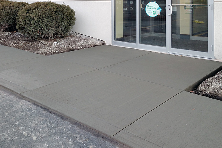 Sidewalk leading up to commercial property.